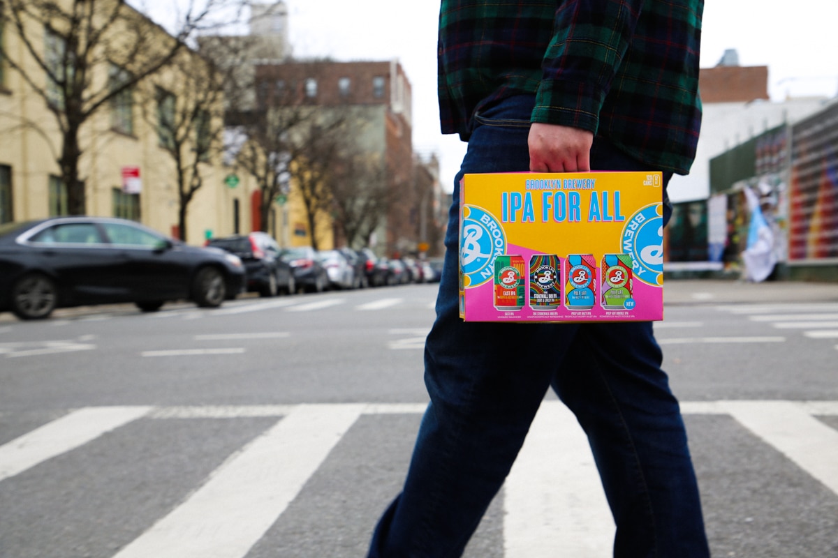 Holding Brooklyn Brewery IPA for All variety pack case while crossing the street